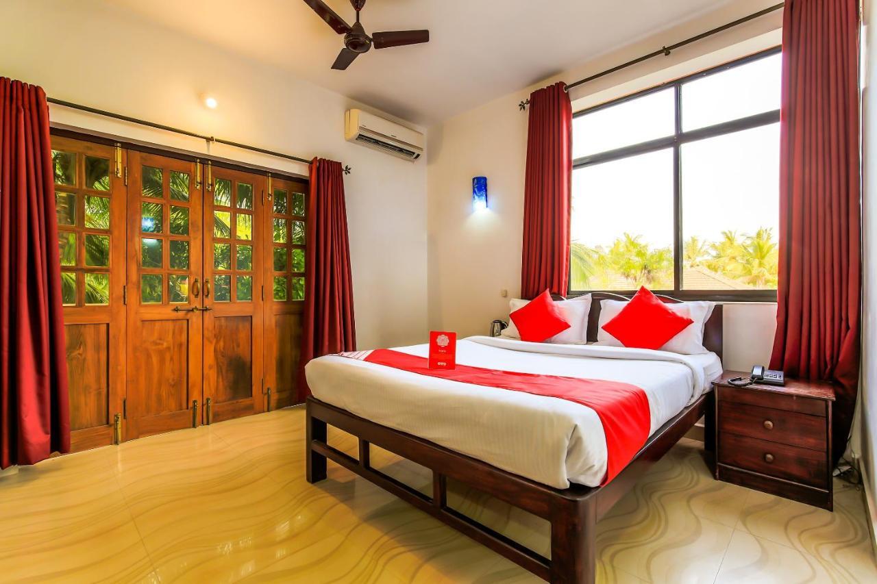 Oyo 13311 The White Feather Hotel 曼德姆 外观 照片