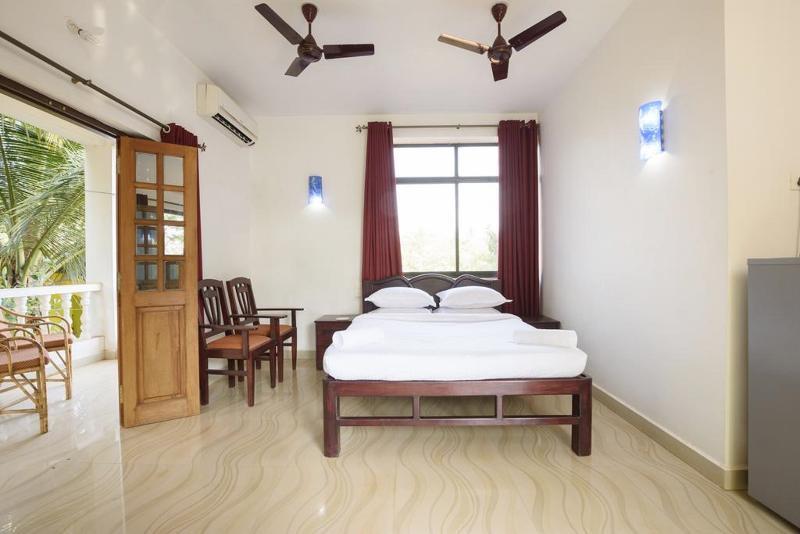 Oyo 13311 The White Feather Hotel 曼德姆 外观 照片